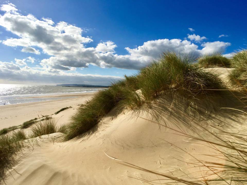 Picnicking among the dunes is one thing to do in Camber Sands