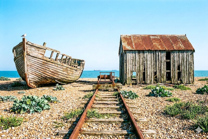 walking along the windswept shingle beach at Dungeness beside the waves