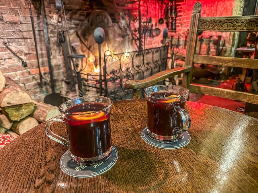 drinks in front of the fire