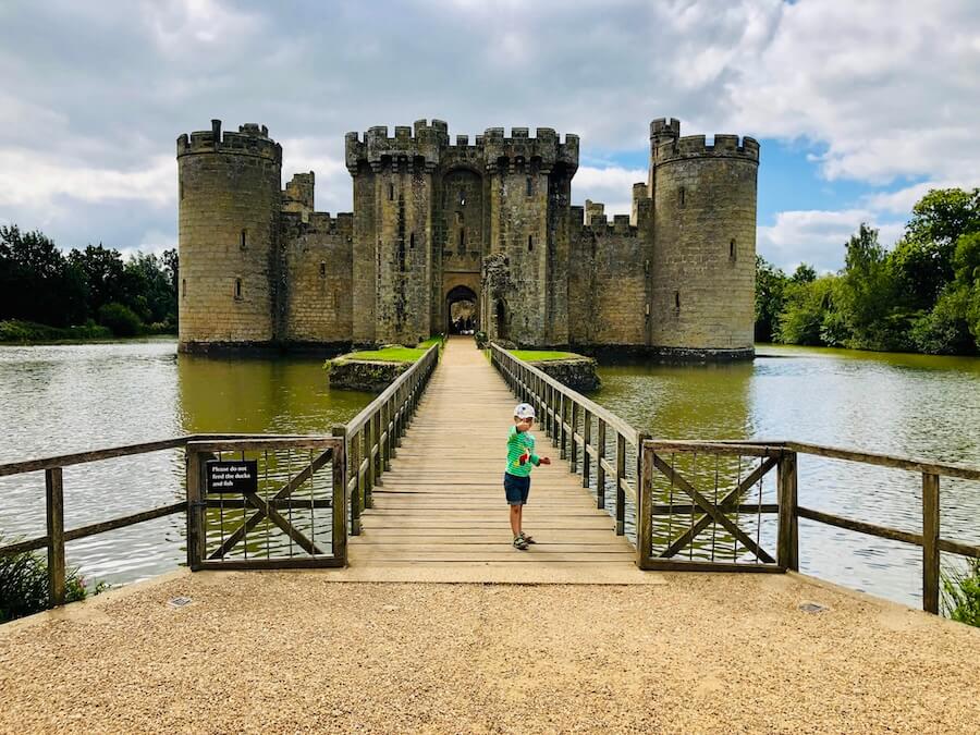 Family day out exploring Bodiam Castle near Camber Sands with kids