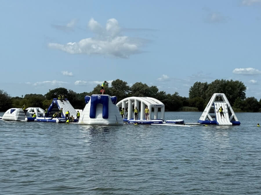 Family enjoying aqua park and water activities near Camber Sands