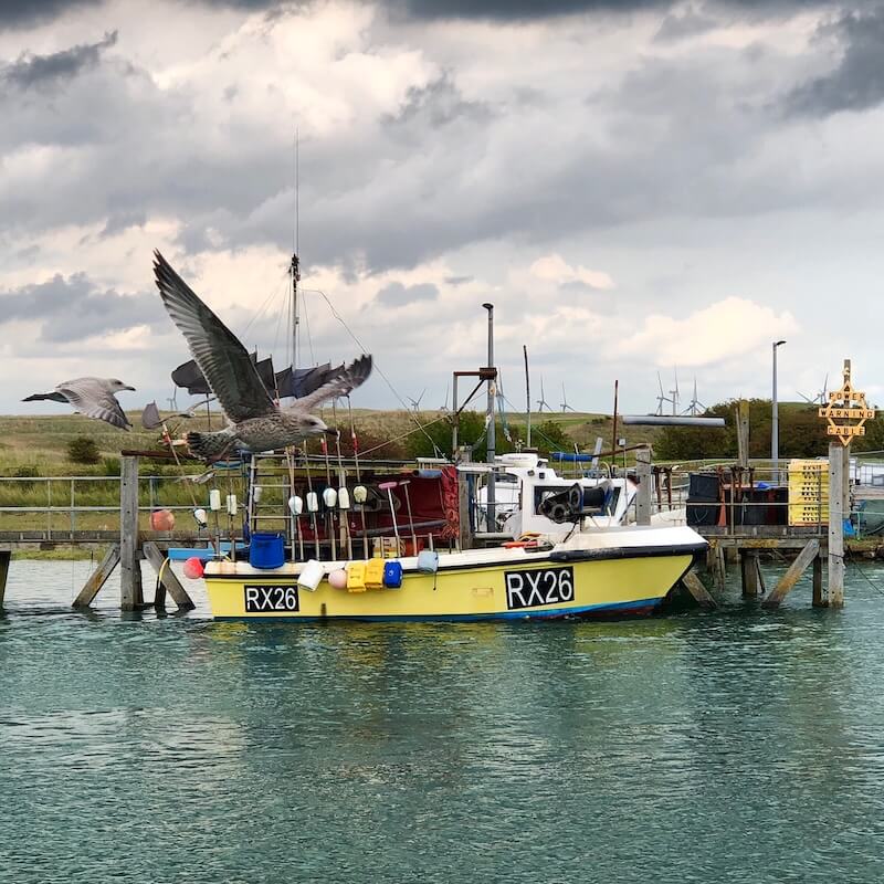 fishing boat at Rye Harbour supplying fresh catch for the best fish and chips in Camber Sands