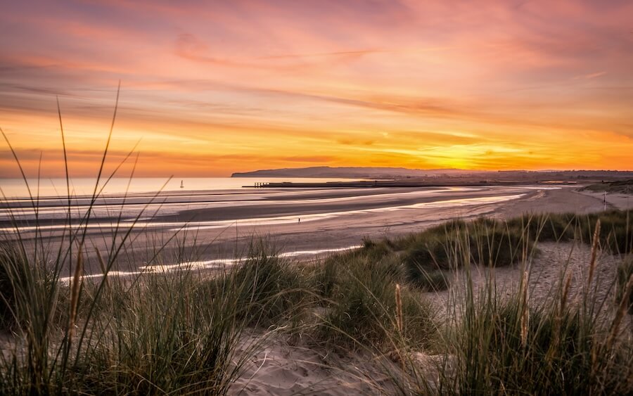 Sunset beach walk in Camber Sands on a short break in Rye and Camber