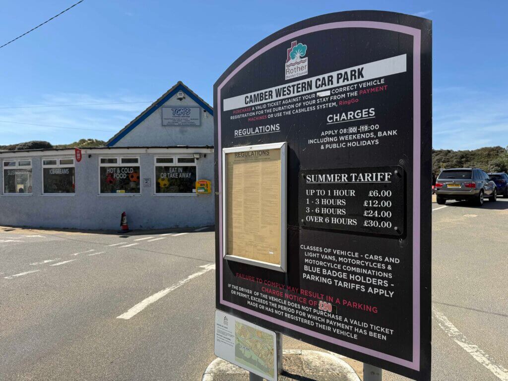 Camber Western car park sign showing the summer parking tariff, photographed August 2026