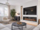 Bright living room at The Rock, Camber Sands, with 65-inch TV, media wall and electric fire