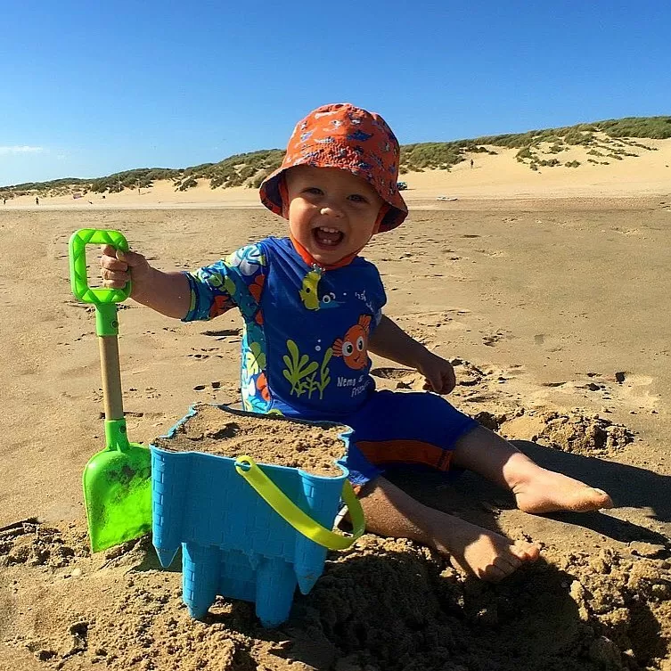 Kids building sandcastles in Camber Sands