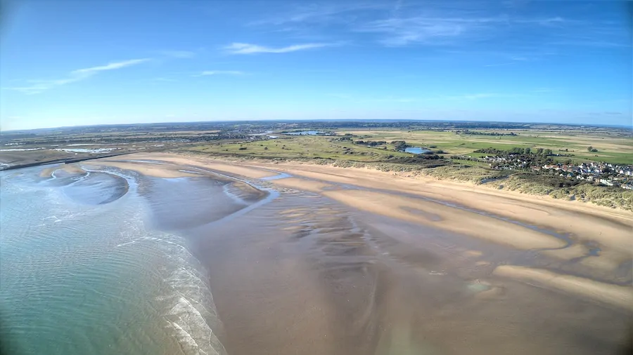 Autumn sky over Camber Sands Beach and East Sussex dunes
