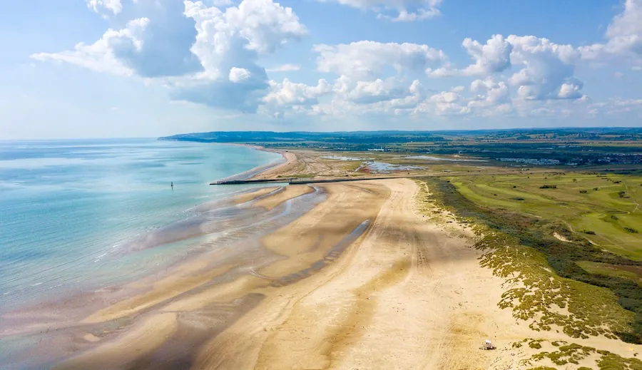 Golden sands, turquoise waters, and endless sky — Camber Sands in summer is pure seaside magic.