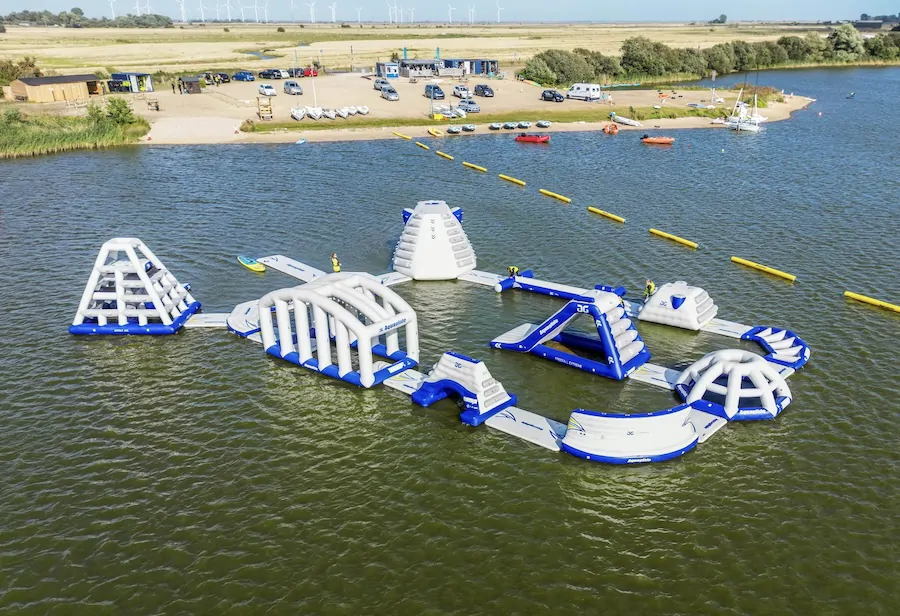 Family enjoying aqua park and water activities near Camber Sands