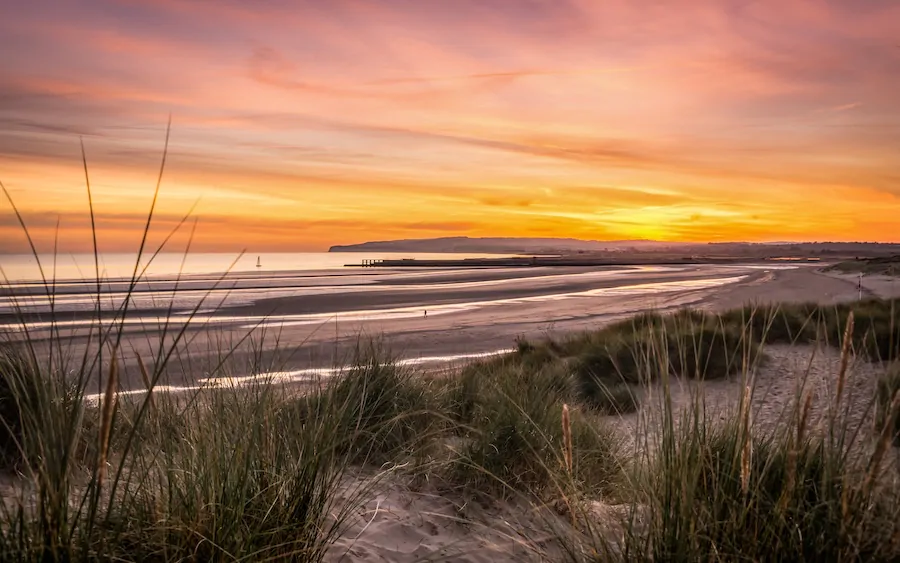 Sunset beach walk in Camber Sands on a short break in Rye and Camber