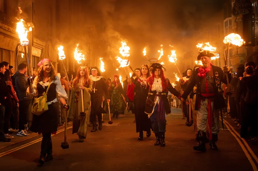 Torchlit procession during the Sussex Bonfire Season with costumes and drums